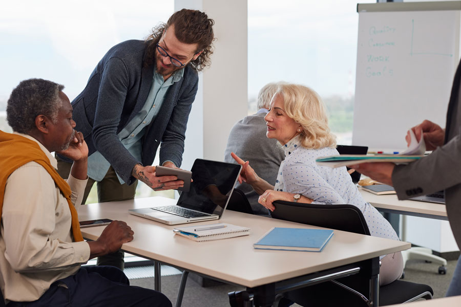 group of people having a discussion in an office setting