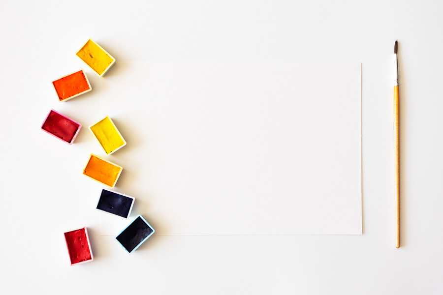 water colour blocks with piece of paper and a single paint brush